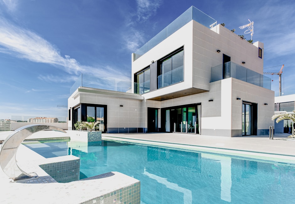 Single-family white facade house representing residential housing